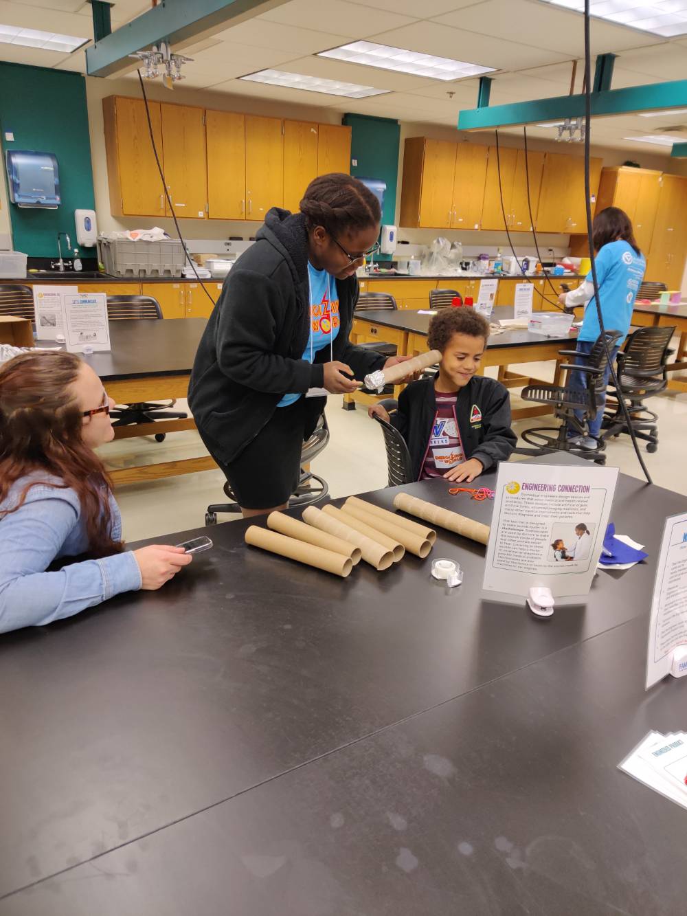 kids engaging in a sound Family Engineering Activity